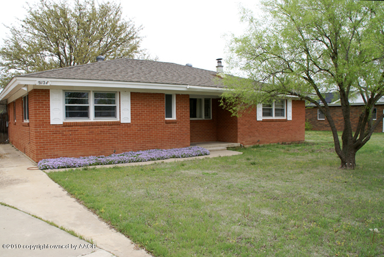 5124 Arden Road Amarillo, TX 79110 - Photo 2 of 42 a front view of a house with a garden