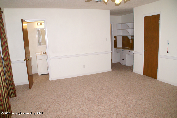 5124 Arden Road Amarillo, TX 79110 - Photo 15 of 42 a view of a kitchen and utility room