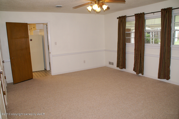 5124 Arden Road Amarillo, TX 79110 - Photo 17 of 42 an empty room with a empty space and chandelier