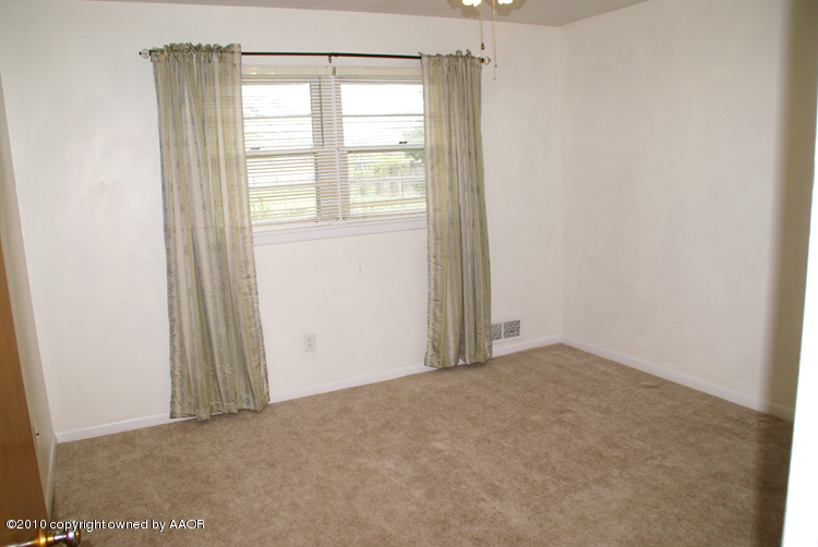 5124 Arden Road Amarillo, TX 79110 - Photo 21 of 42 an empty room with a window