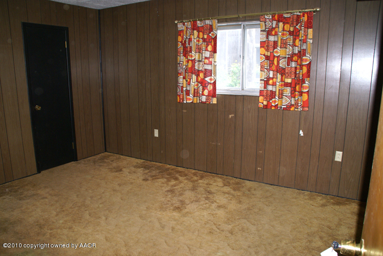 5124 Arden Road Amarillo, TX 79110 - Photo 27 of 42 a view of an empty room with windows