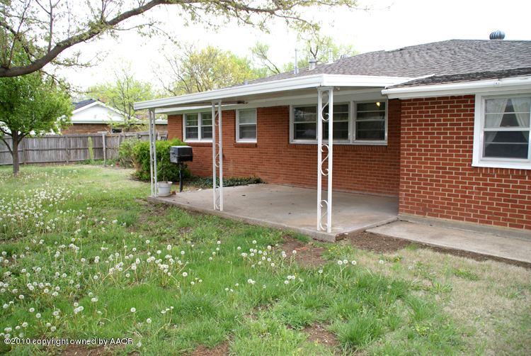 5124 Arden Road Amarillo, TX 79110 - Photo 37 of 42 a view of backyard with table and chairs and wooden fence