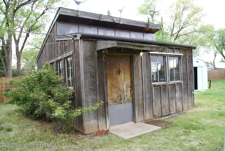 5124 Arden Road Amarillo, TX 79110 - Photo 40 of 42 a front view of a house with a garden