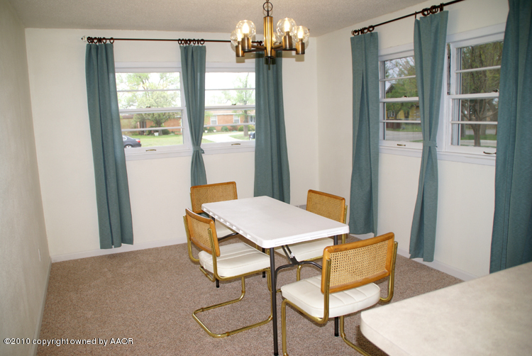 5124 Arden Road Amarillo, TX 79110 - Photo 8 of 42 a view of a room with a table and chairs