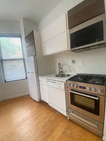 a kitchen with a stove and a microwave