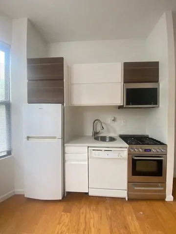 a kitchen with a stove and a microwave