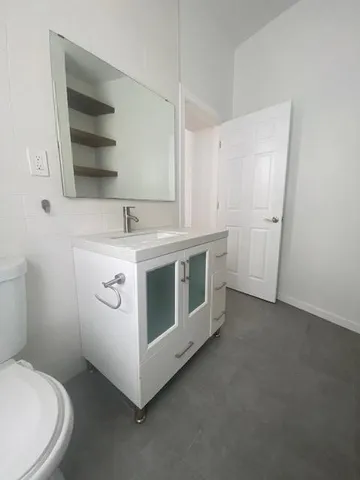 a utility room with cabinets washer and dryer