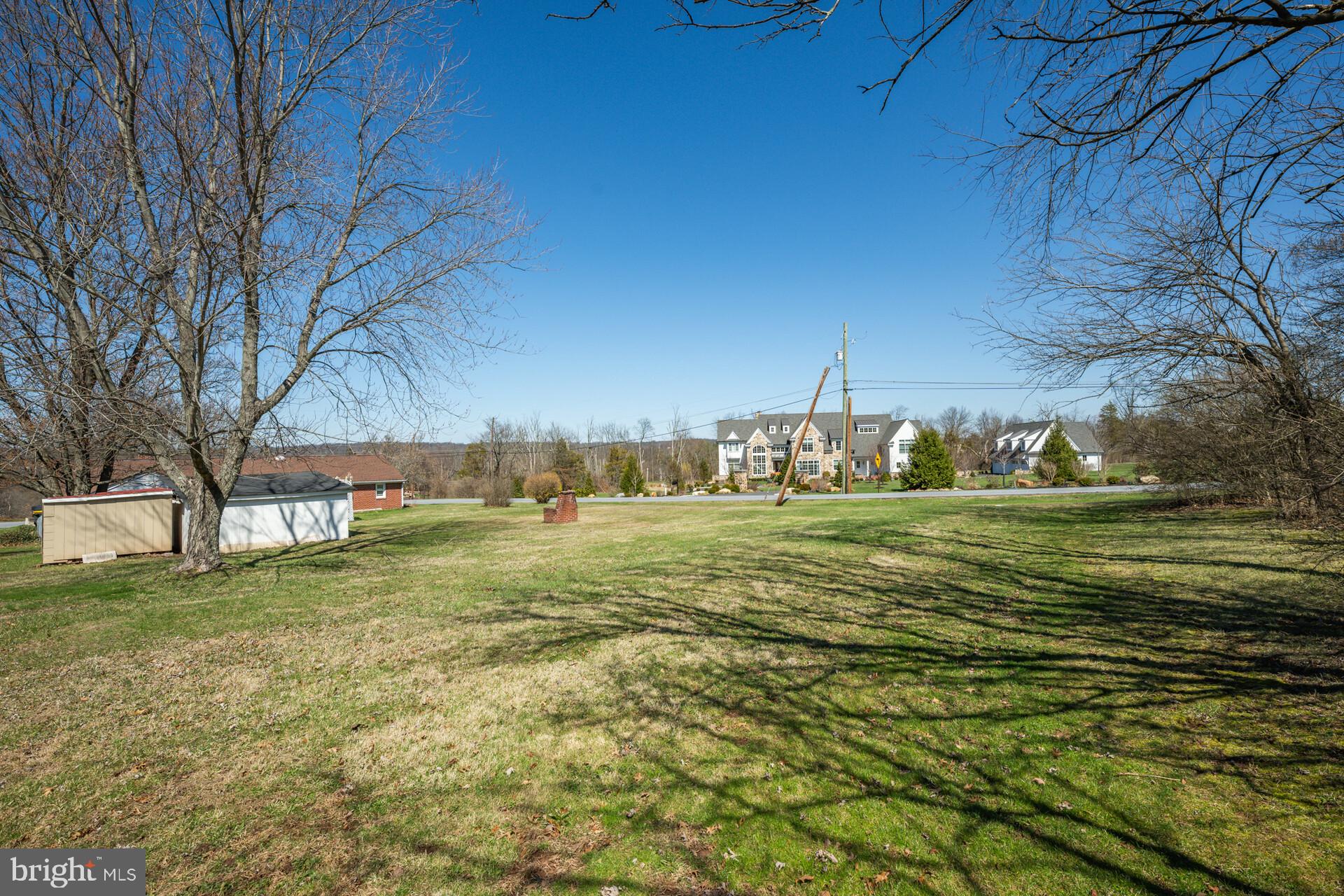 874 Sunset Lane Telford, PA 18969 - Photo 14 of 35 a view of a big yard with a fountain