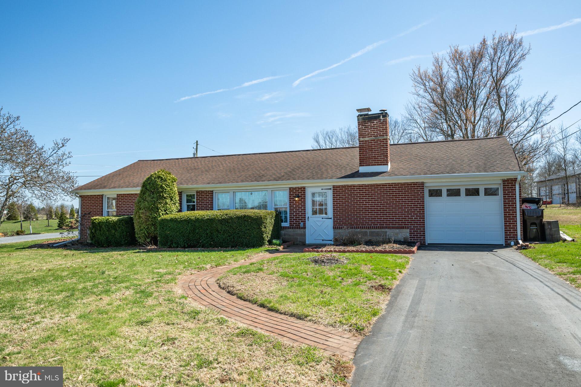 874 Sunset Lane Telford, PA 18969 - Photo 2 of 35 a front view of house with yard and garage