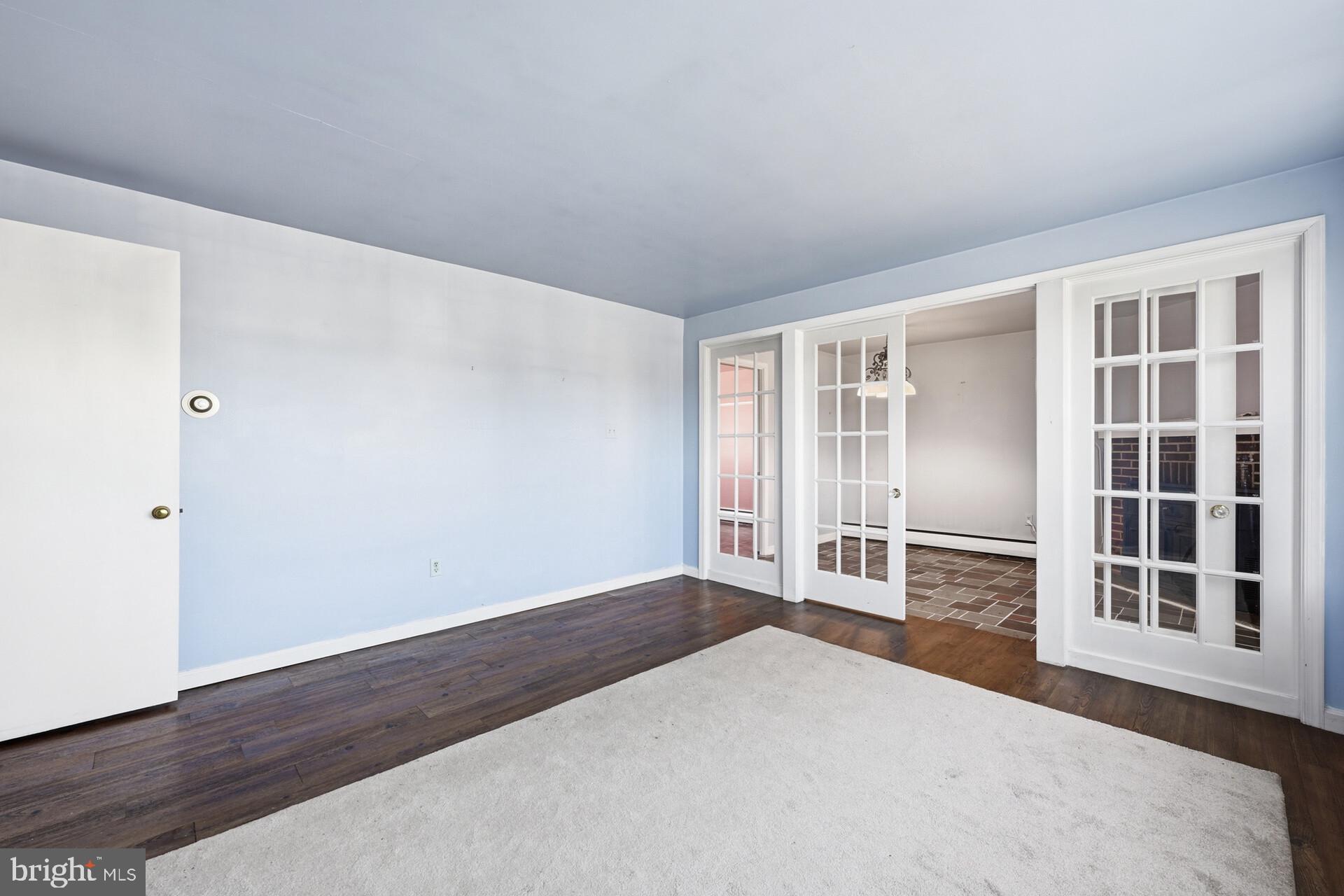 874 Sunset Lane Telford, PA 18969 - Photo 21 of 35 a view of an empty room with wooden floor and windows