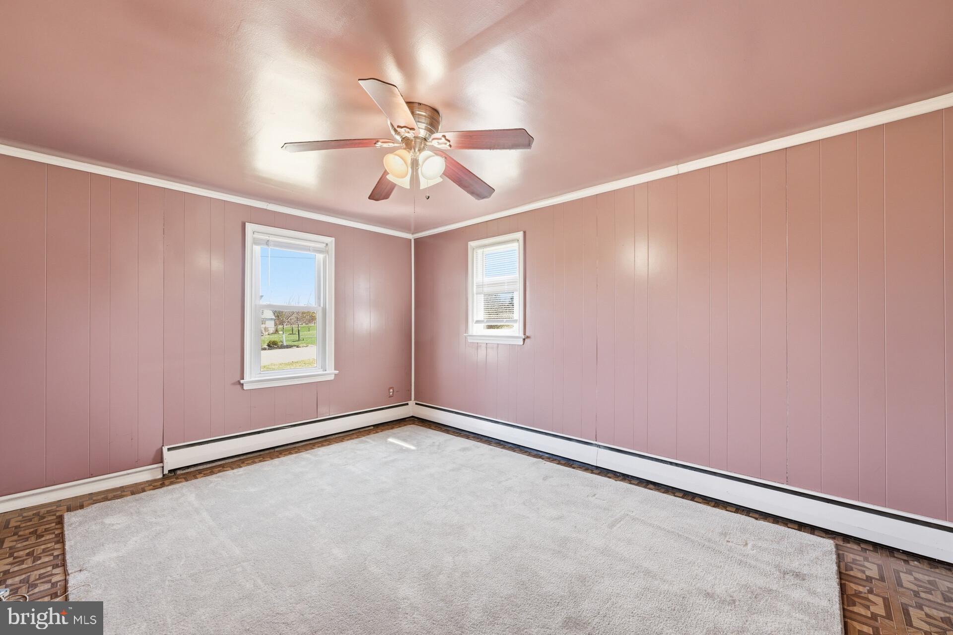 874 Sunset Lane Telford, PA 18969 - Photo 31 of 35 an empty room with windows and fan