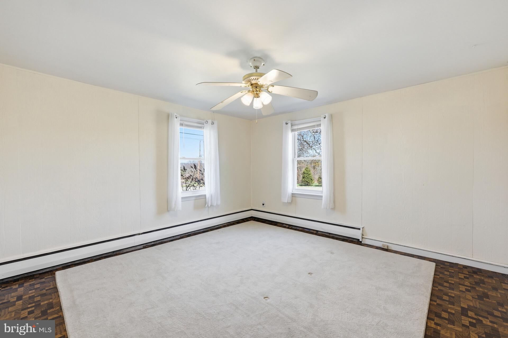874 Sunset Lane Telford, PA 18969 - Photo 33 of 35 an empty room with windows and fan