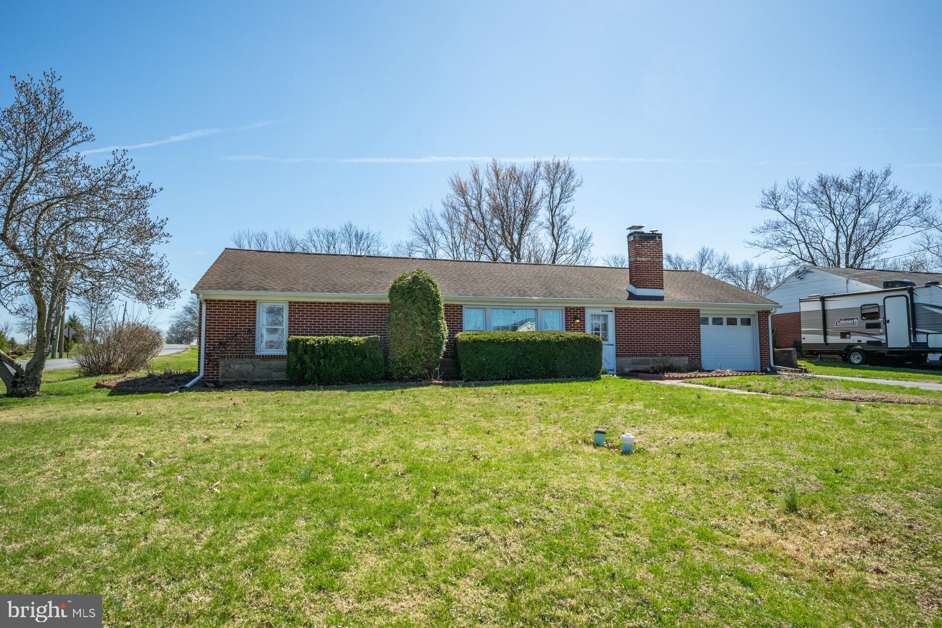874 Sunset Lane Telford, PA 18969 - Photo 4 of 35 a house view with a sitting space and garden