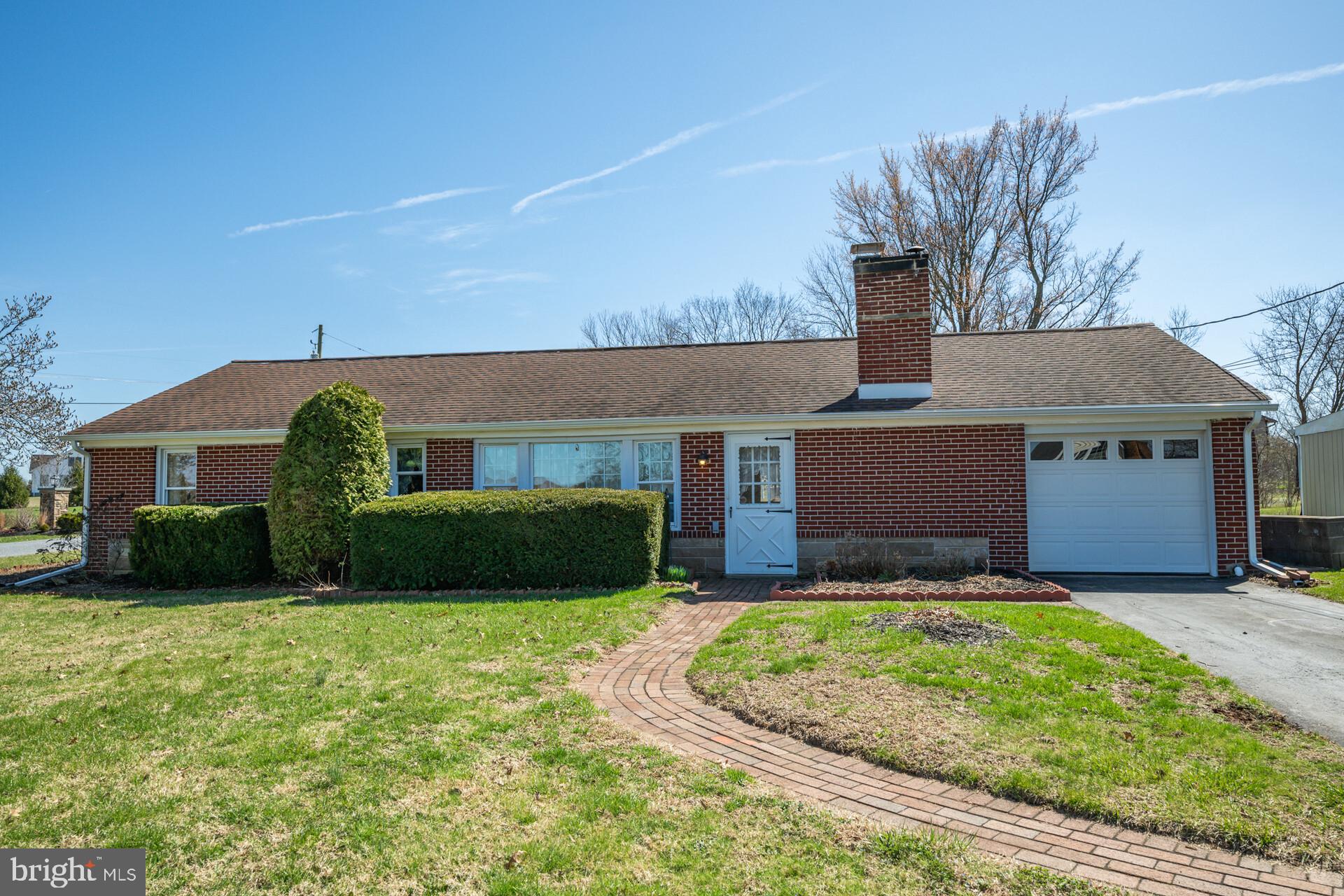 874 Sunset Lane Telford, PA 18969 - Photo 5 of 35 a front view of a house with a yard and garage