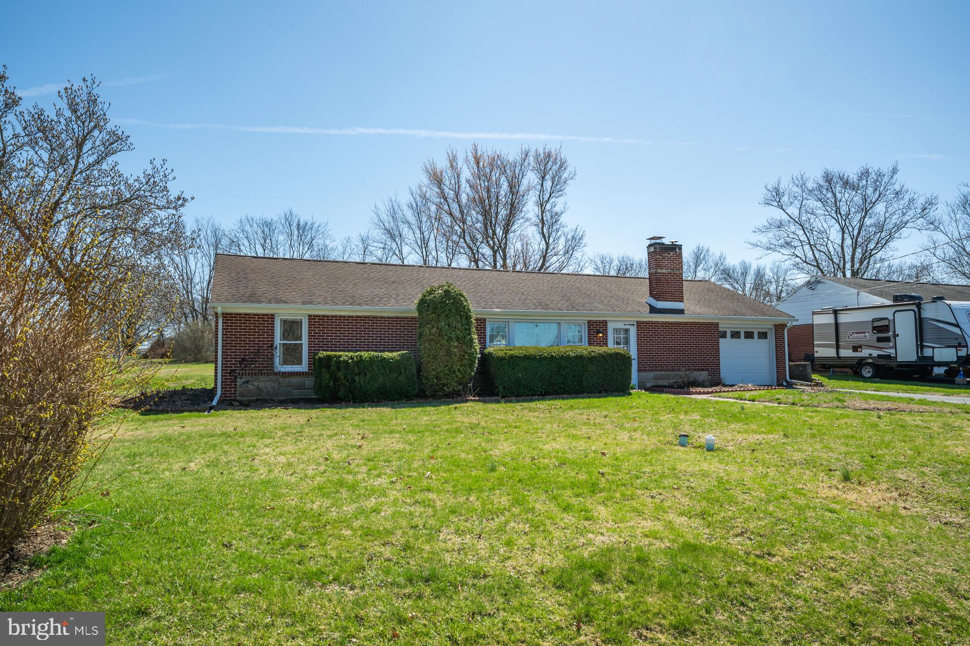 874 Sunset Lane Telford, PA 18969 - Photo 6 of 35 a house view with a sitting space and garden
