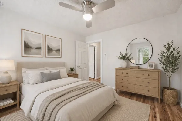 a bedroom with a bed and a dresser