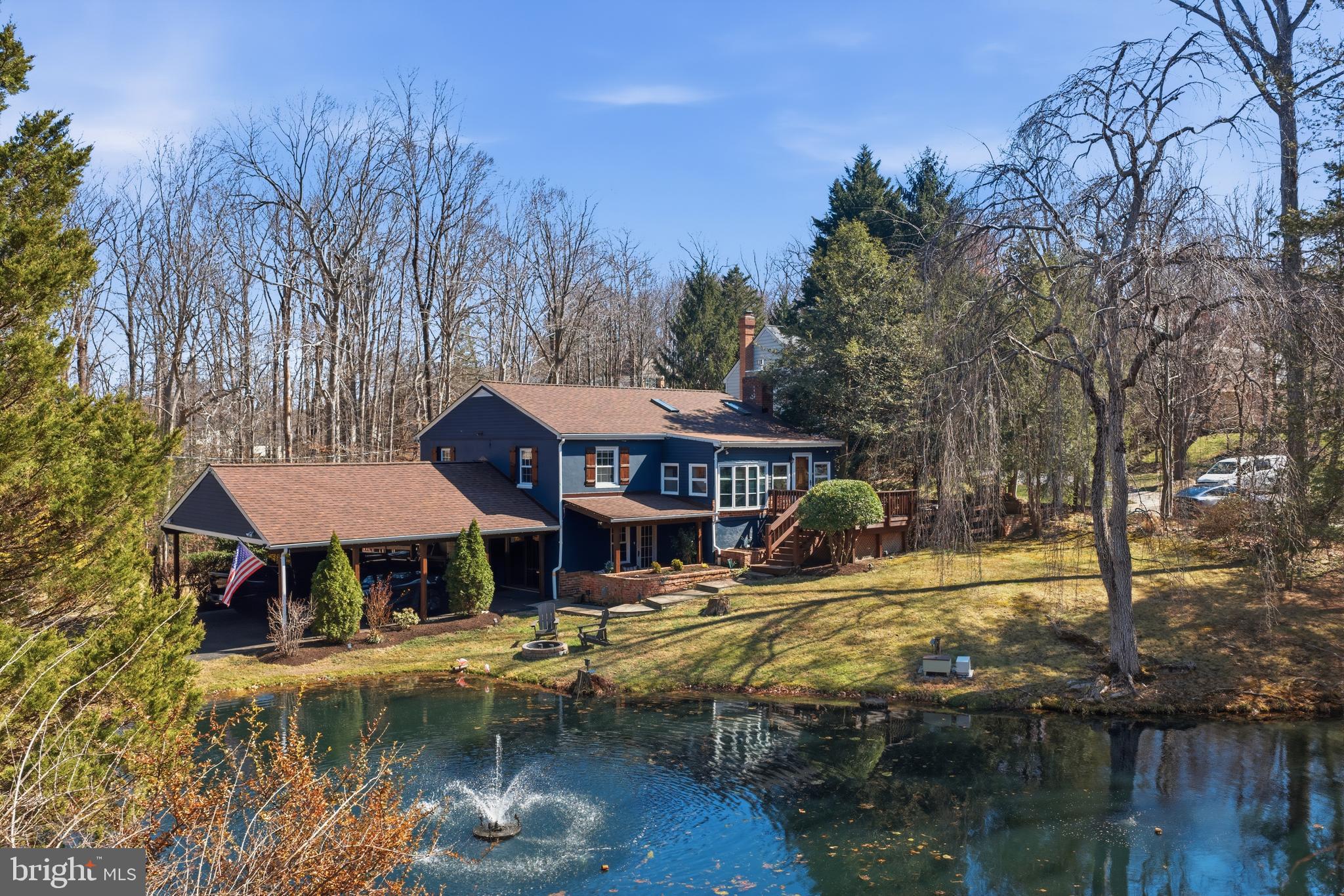 a view of house with outdoor space and lake view