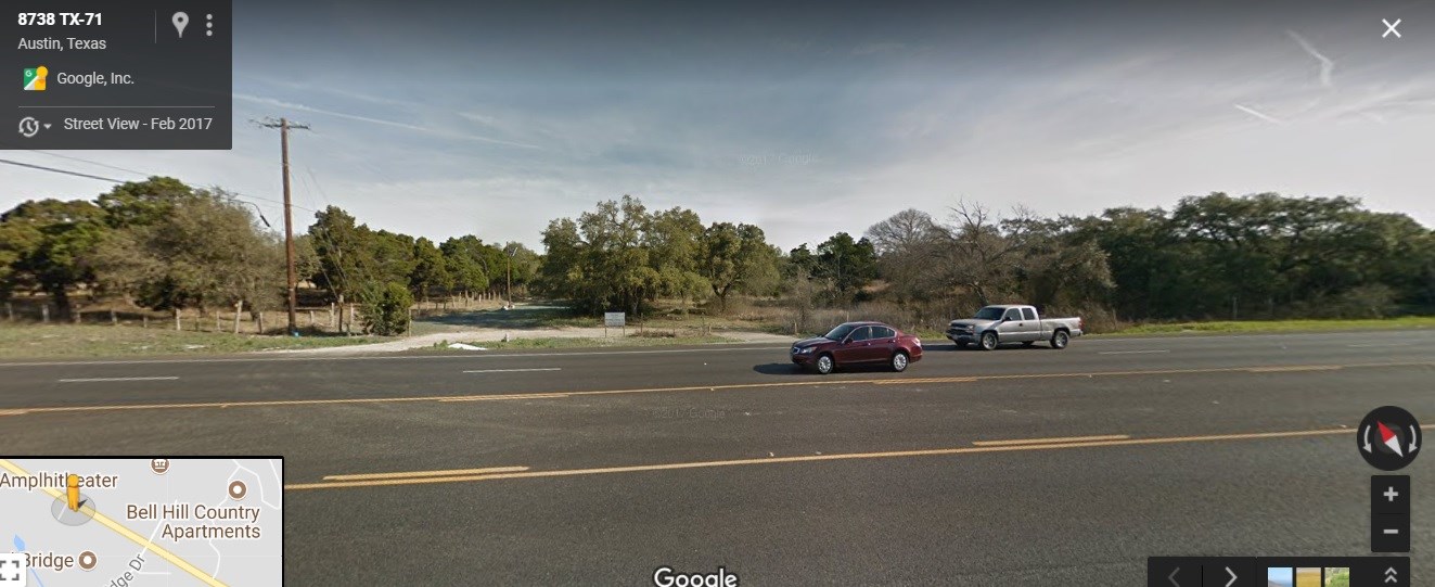 a view of street with parked cars