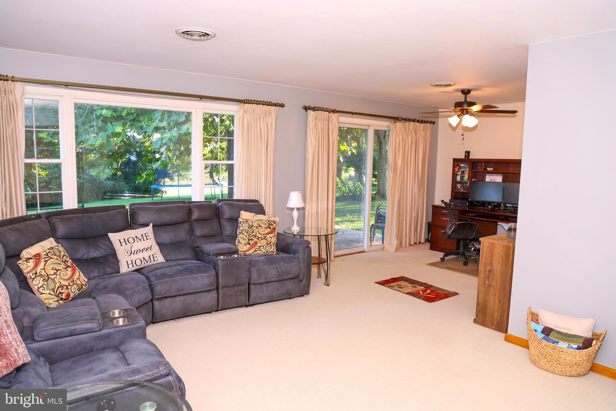 19717 Toms Road Boonsboro, MD 21713 - Photo 12 of 60 a living room with furniture and a large window