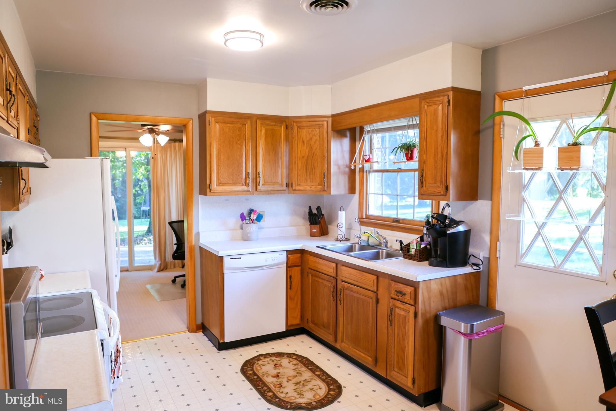 19717 Toms Road Boonsboro, MD 21713 - Photo 15 of 60 a kitchen with a sink cabinets and window