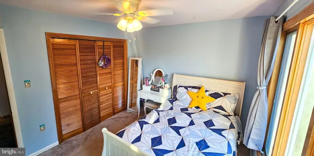 a bedroom with a bed and a table in it