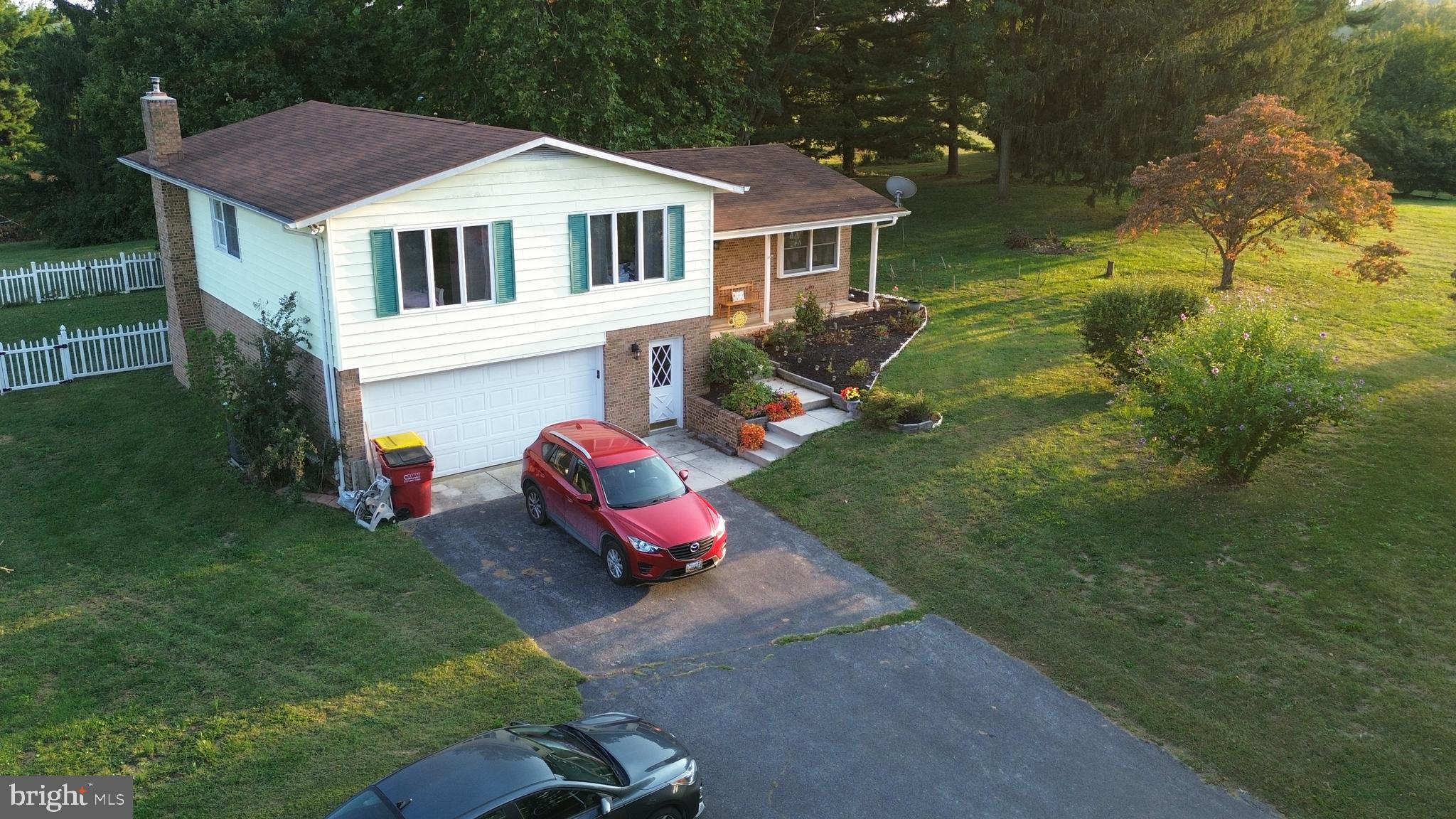19717 Toms Road Boonsboro, MD 21713 - Photo 2 of 60 a front view of a house with garden