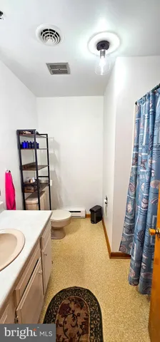 a view of a bathroom with a sink and a mirror
