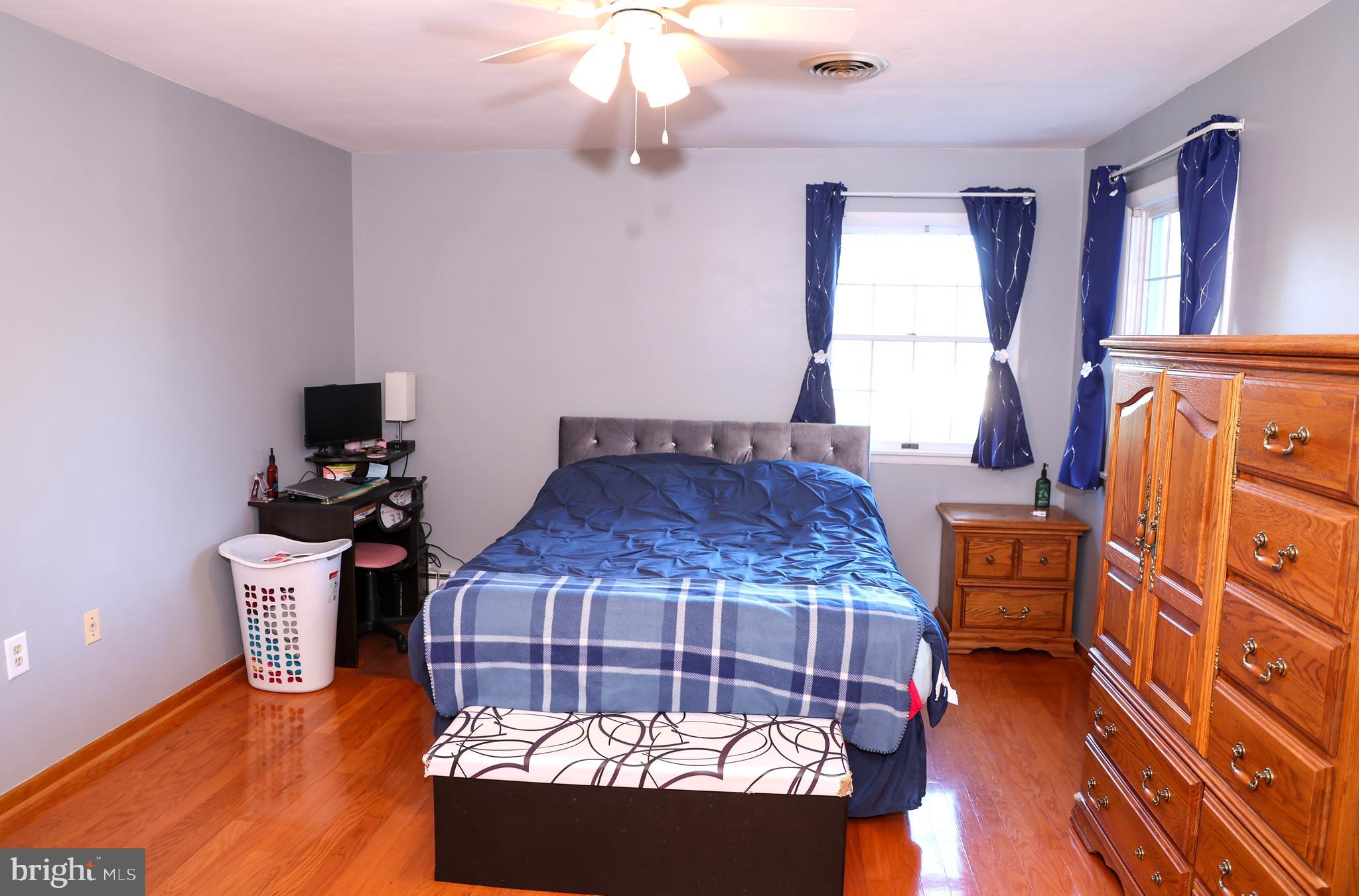 19717 Toms Road Boonsboro, MD 21713 - Photo 26 of 60 a bedroom with a bed and wooden floor