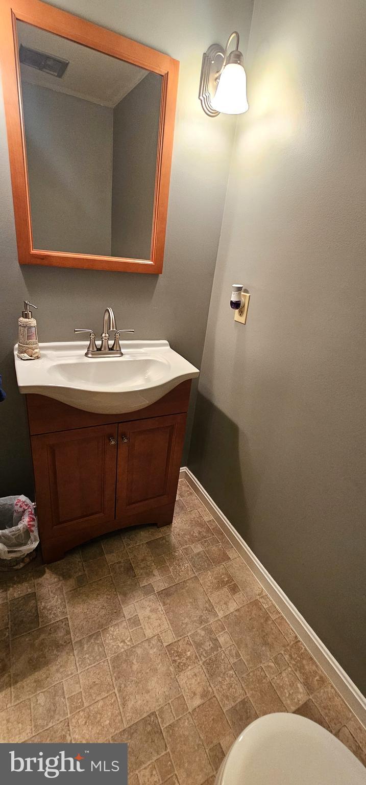 19717 Toms Road Boonsboro, MD 21713 - Photo 28 of 60 a bathroom with a sink and a mirror