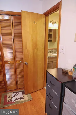 a view of a livingroom with wooden floor and staircase