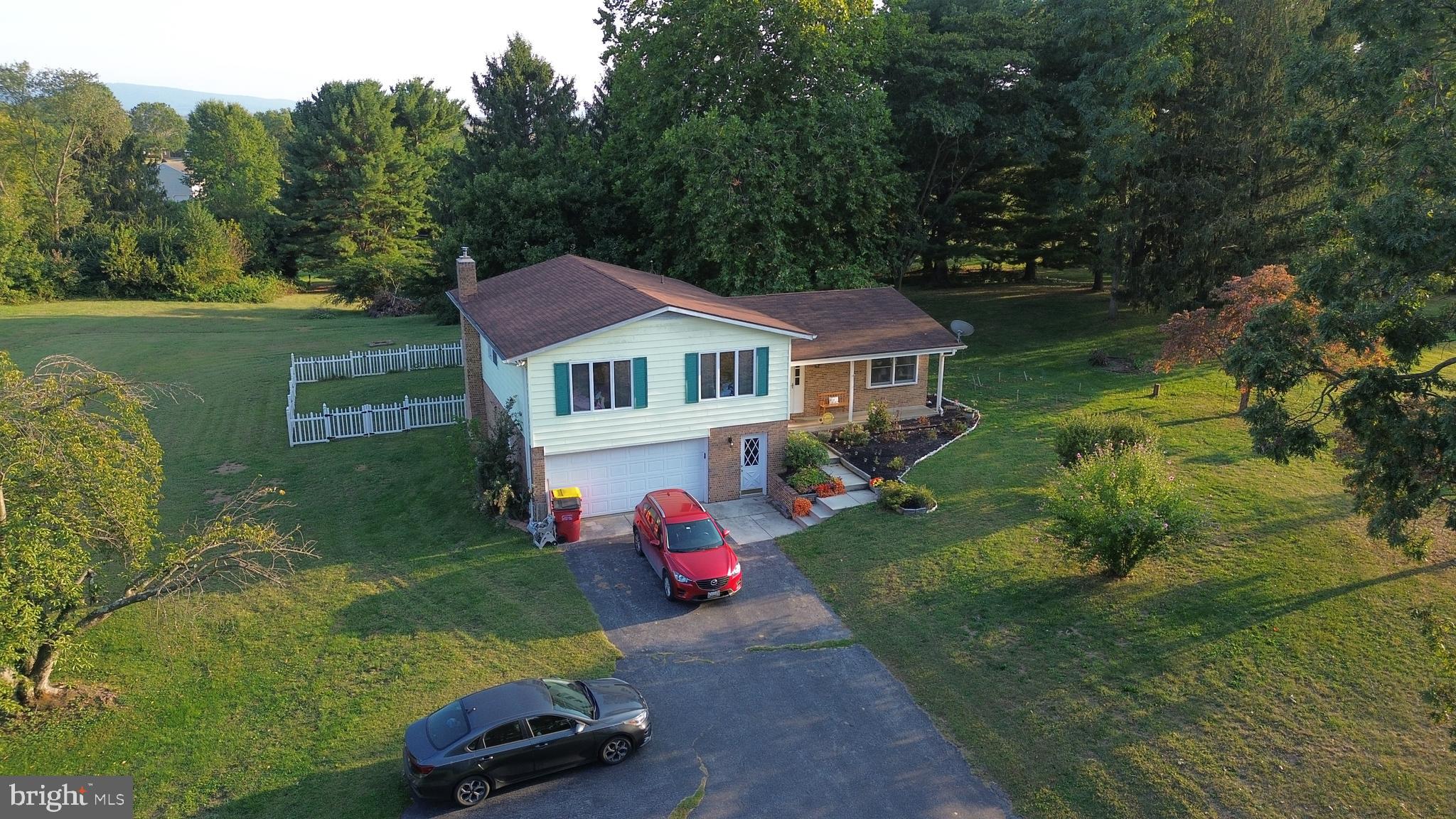19717 Toms Road Boonsboro, MD 21713 - Photo 3 of 60 a house view with a garden space