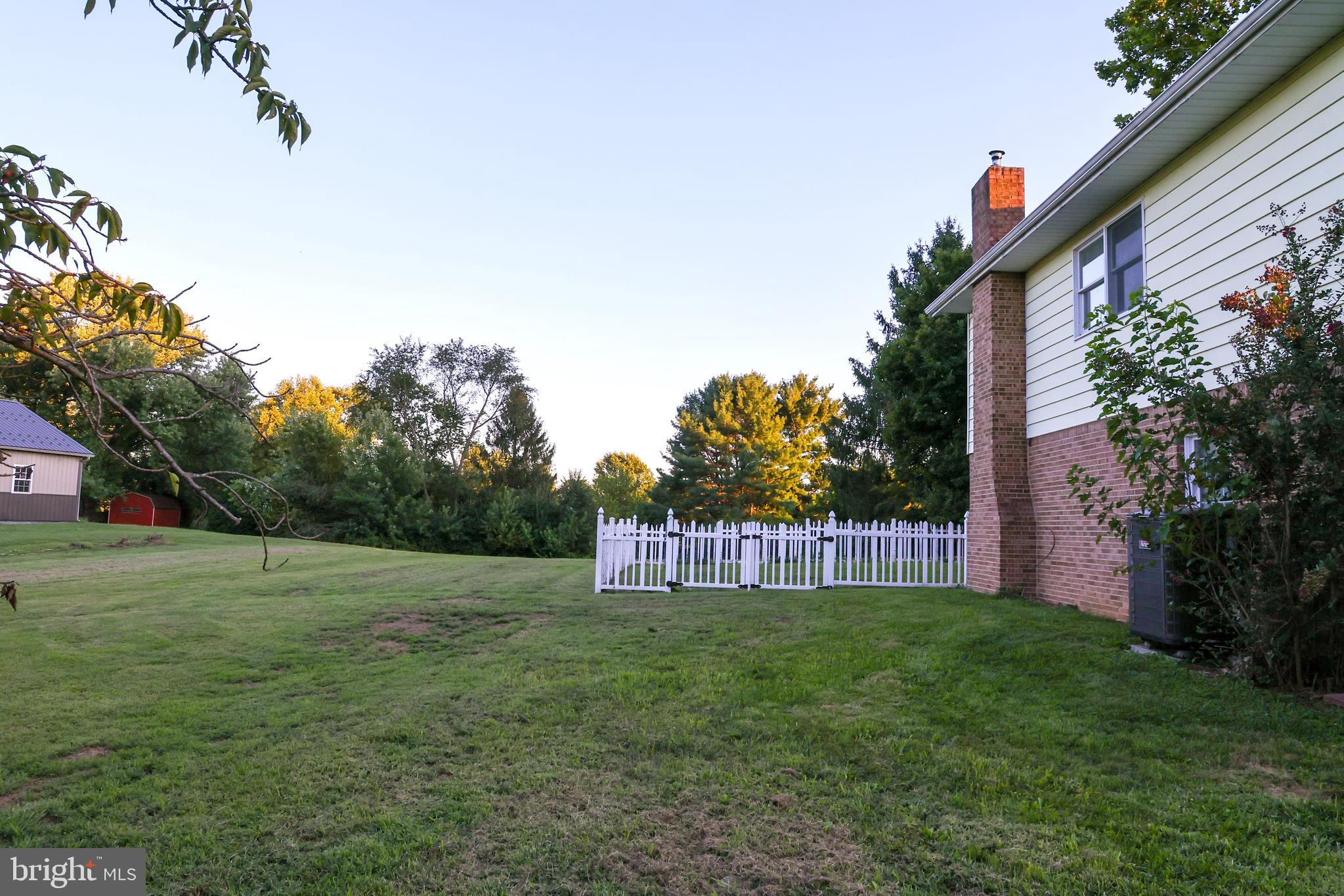 19717 Toms Road Boonsboro, MD 21713 - Photo 40 of 60 a view of a back yard with an tree