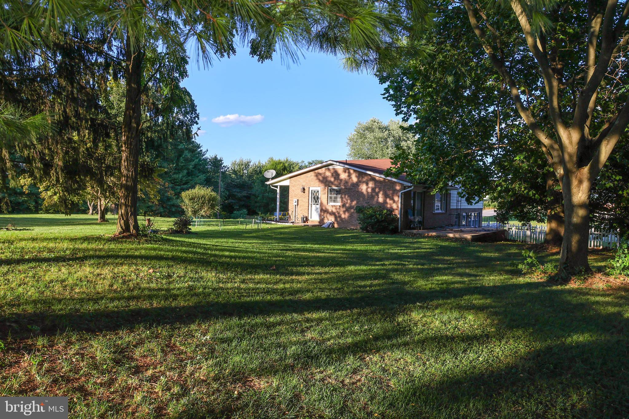 19717 Toms Road Boonsboro, MD 21713 - Photo 45 of 60 a view of a golf course with a lake