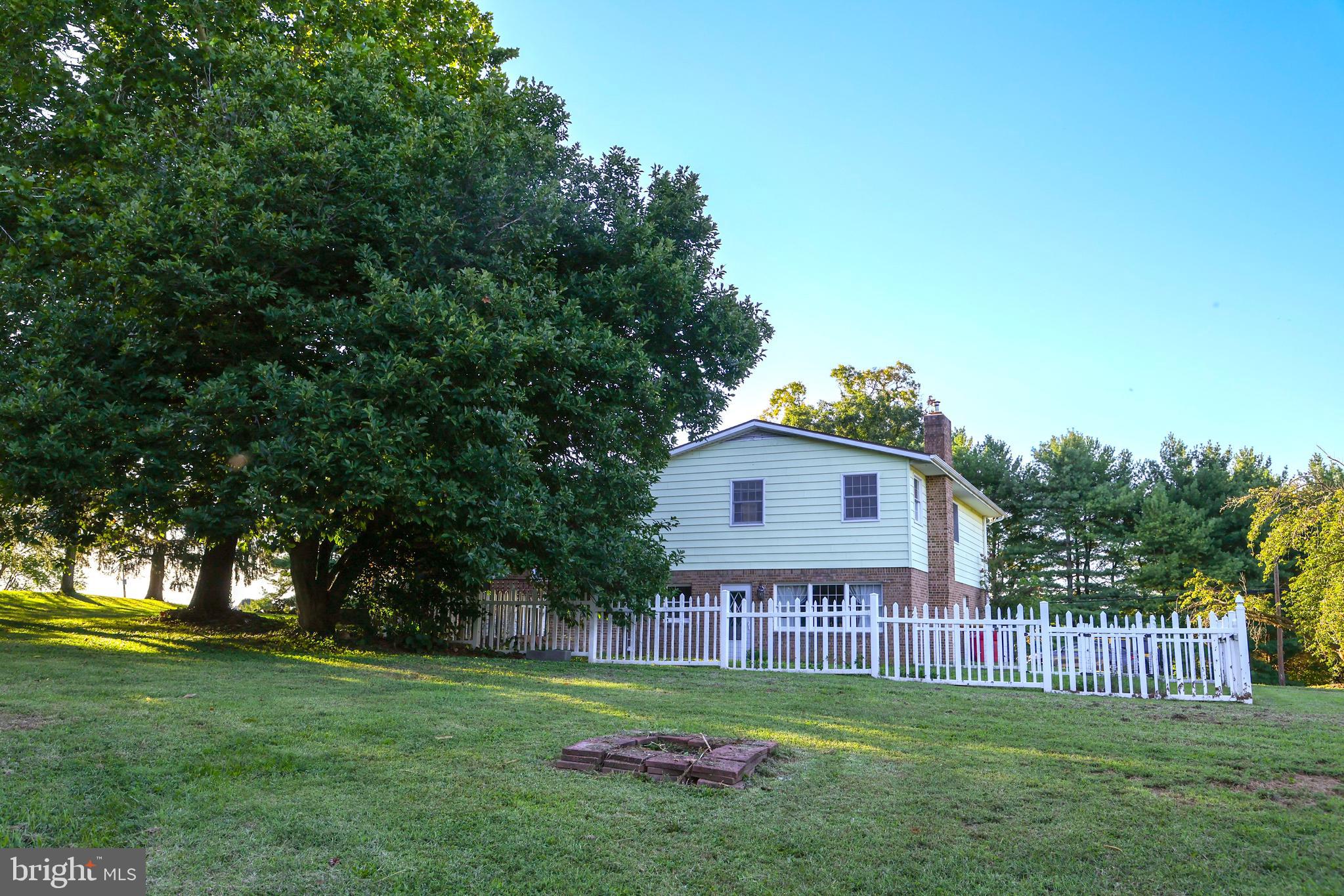 19717 Toms Road Boonsboro, MD 21713 - Photo 48 of 60 a view of a small yard in front of a house