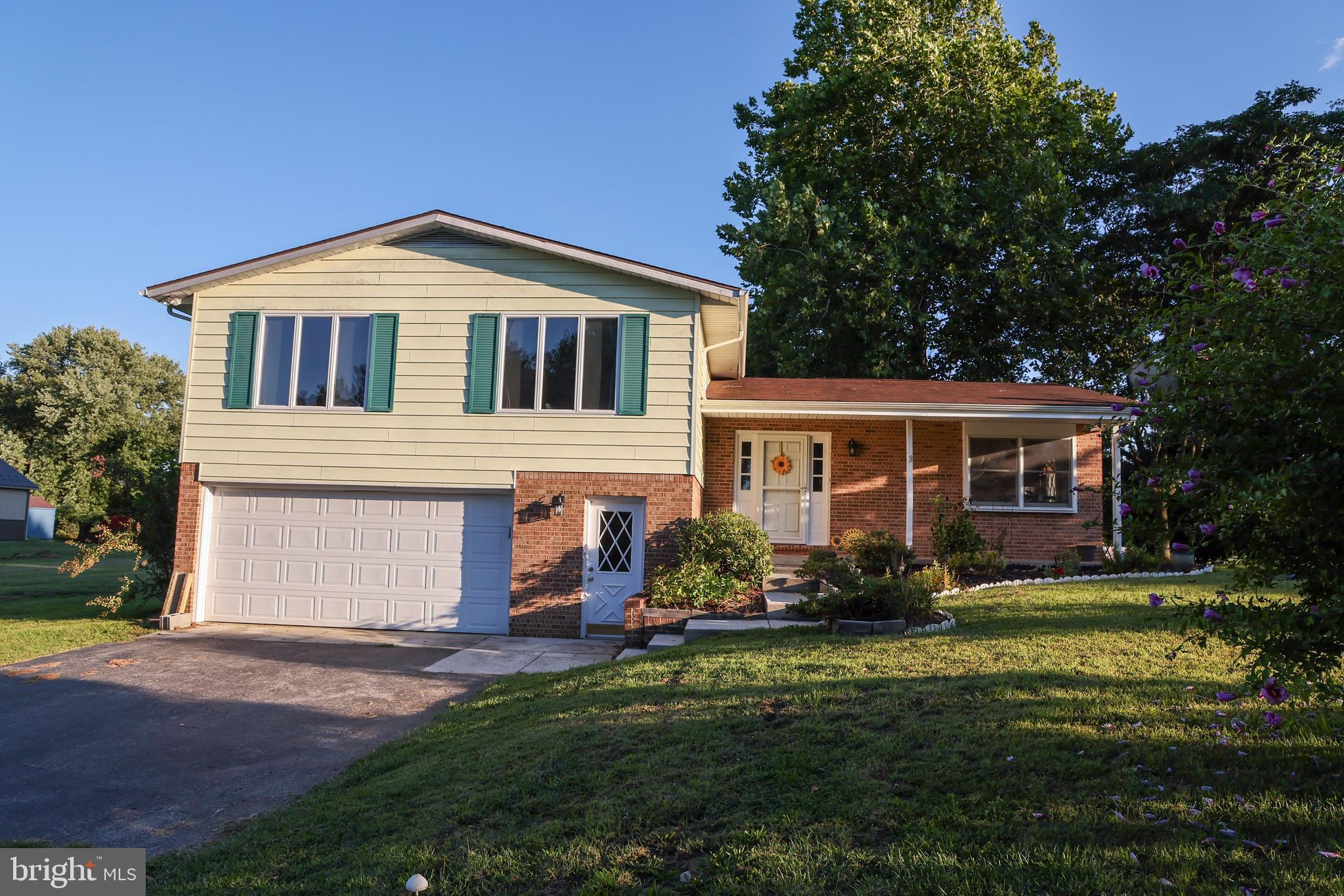 19717 Toms Road Boonsboro, MD 21713 - Photo 7 of 60 a front view of a house with a yard and garage