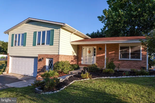 a front view of a house with a yard and porch