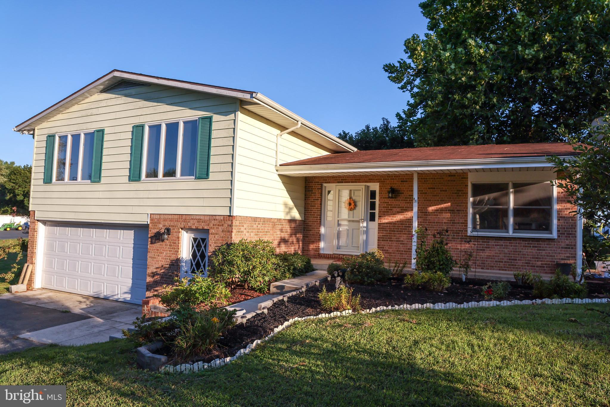 19717 Toms Road Boonsboro, MD 21713 - Photo 8 of 60 a front view of a house with a yard and porch