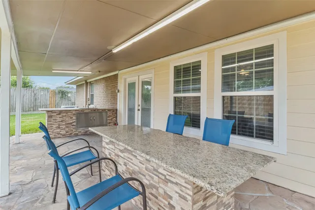 a view of a lounge chairs in the patio