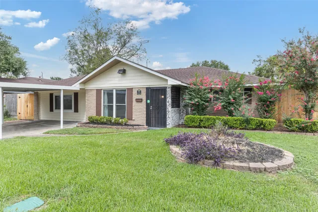 a front view of a house with a yard and porch