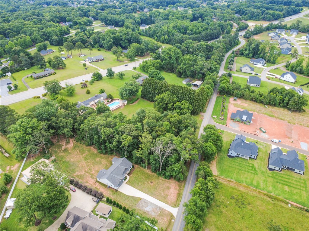 3080 McGee Road Iva, SC 29655 - Photo 46 of 49 An aerial panorama reveals a vast green landscape dotted with residential homes and ample natural greenery.