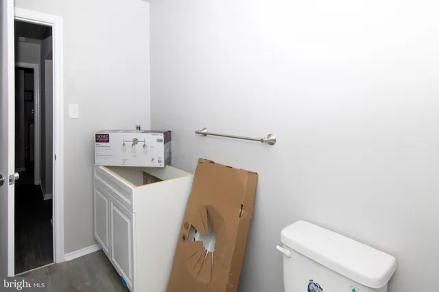 a bathroom with a toilet and a sink