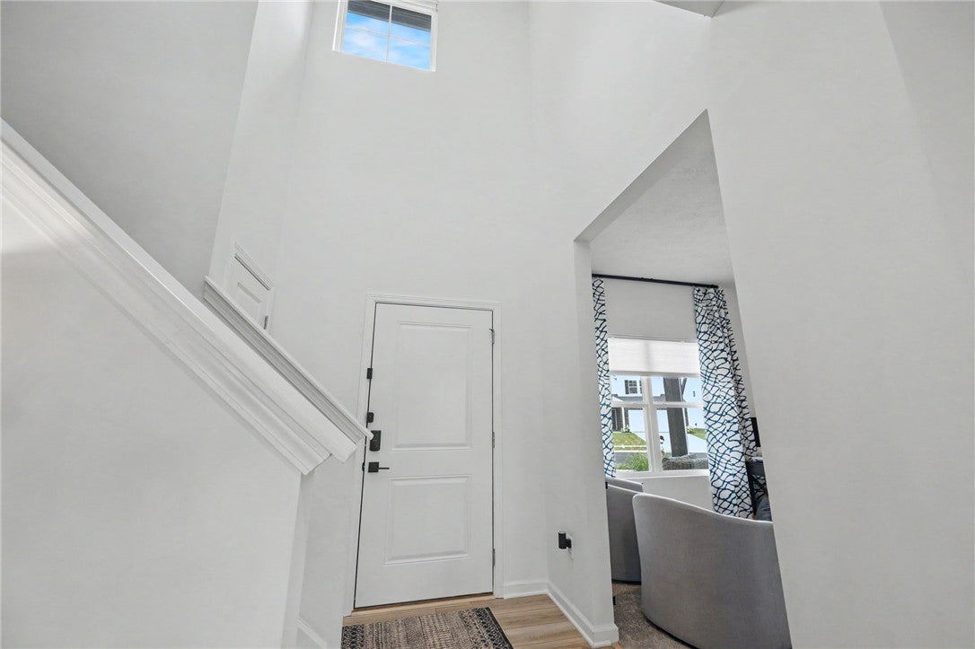 3011 Falls Road Clayton, OH 45315 - Photo 10 of 66 A welcoming entryway with soaring ceilings and a sun-filled transom window above the entry door.