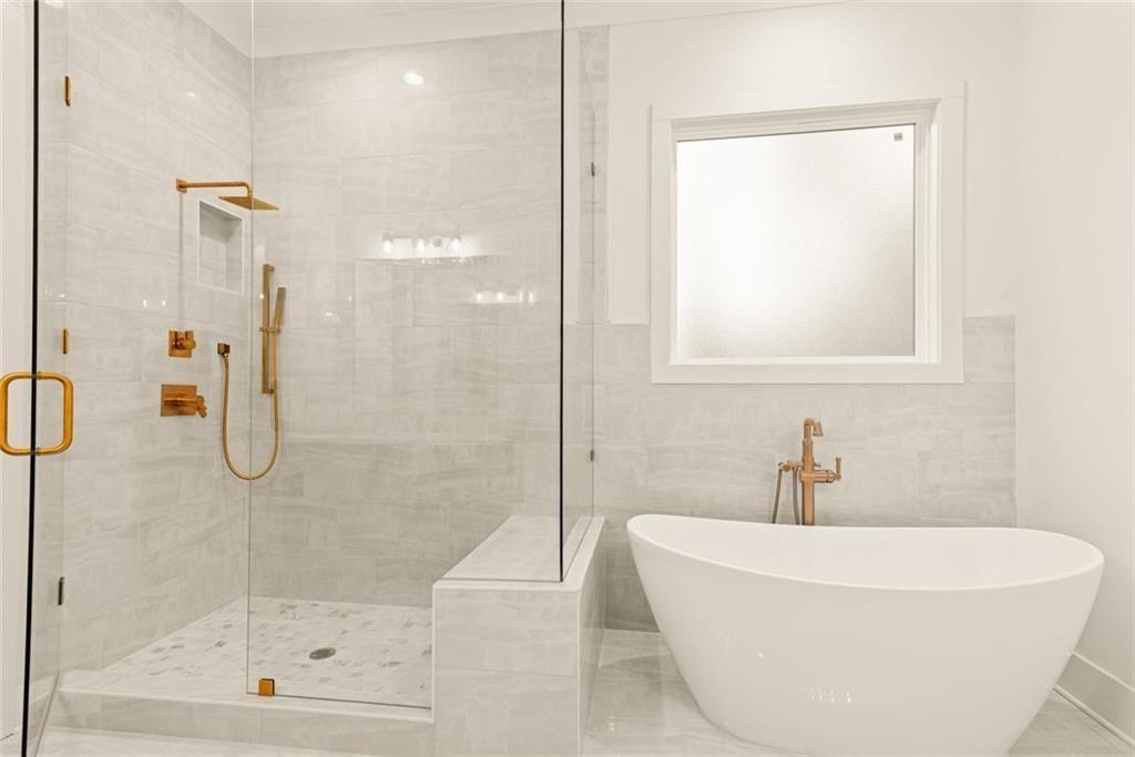 240 Highlands Ball Ground, GA 30107 - Photo 33 of 57 a white bath tub sitting next to a shower