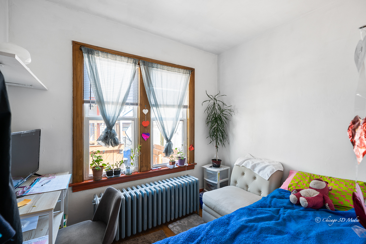4954 West Byron Street Chicago, IL 60641 - Photo 12 of 42 a living room with furniture and a window