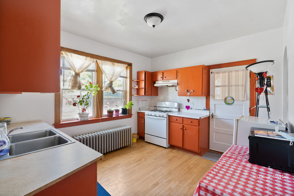 4954 West Byron Street Chicago, IL 60641 - Photo 14 of 42 a bedroom with furniture and a large window