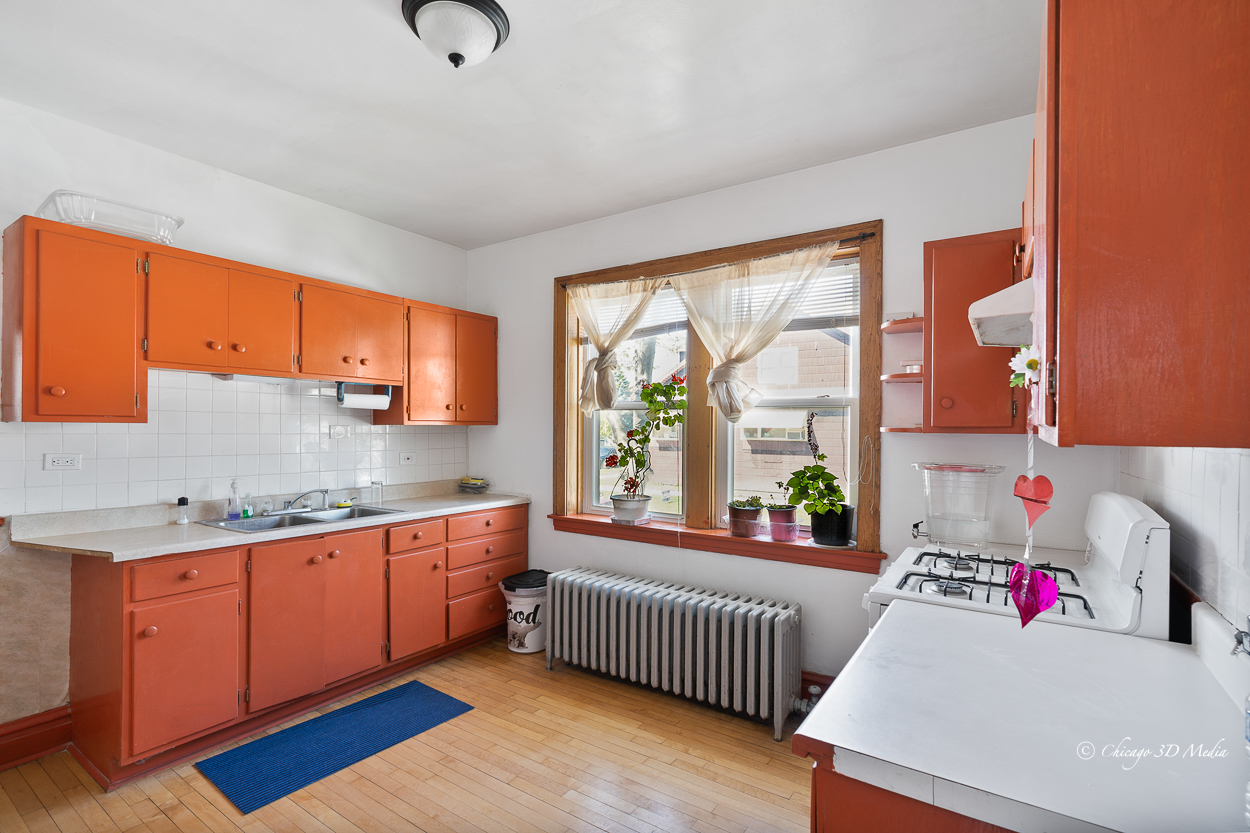 4954 West Byron Street Chicago, IL 60641 - Photo 15 of 42 a bedroom with furniture and a large window