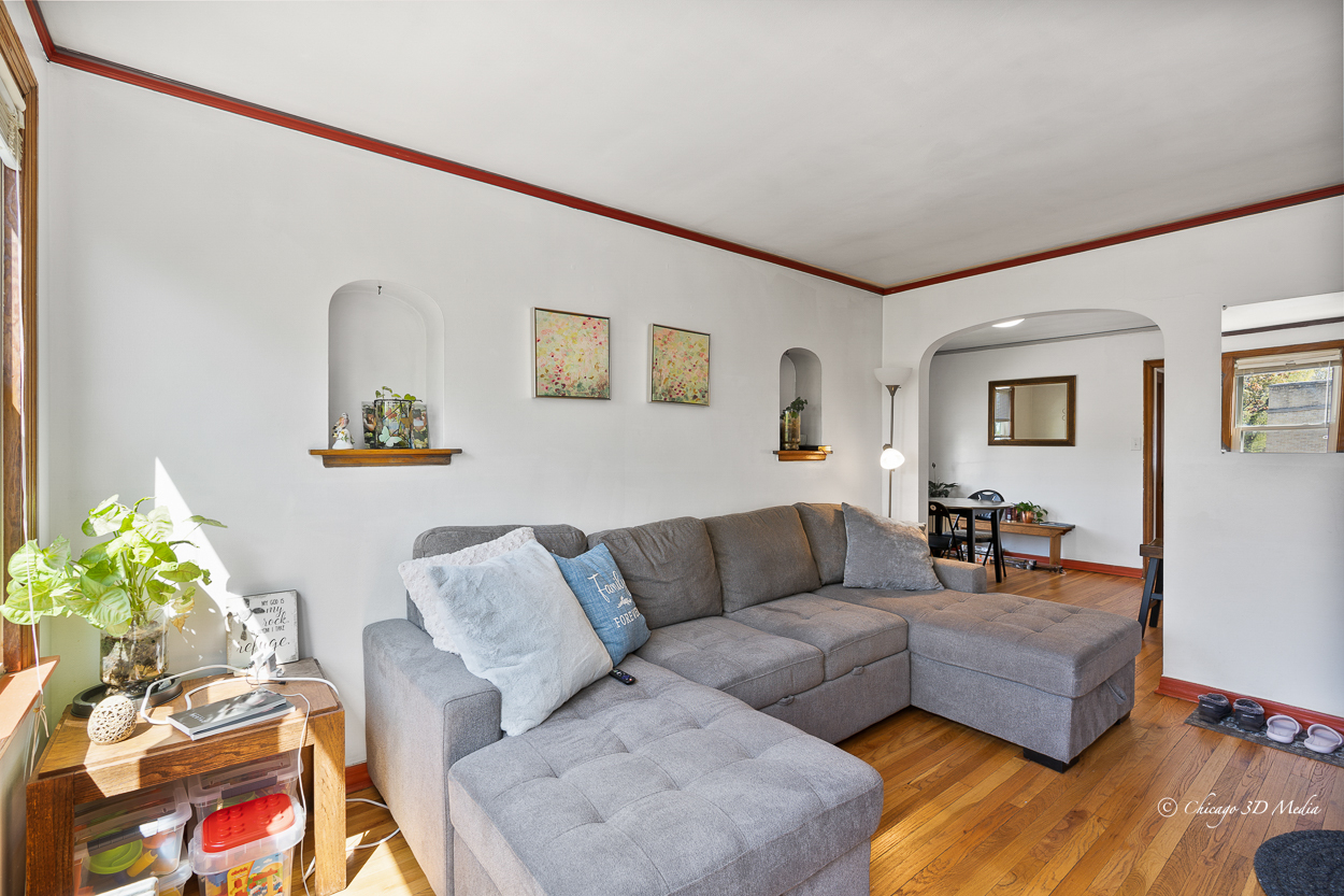 4954 West Byron Street Chicago, IL 60641 - Photo 16 of 42 a living room with furniture and painting on the wall