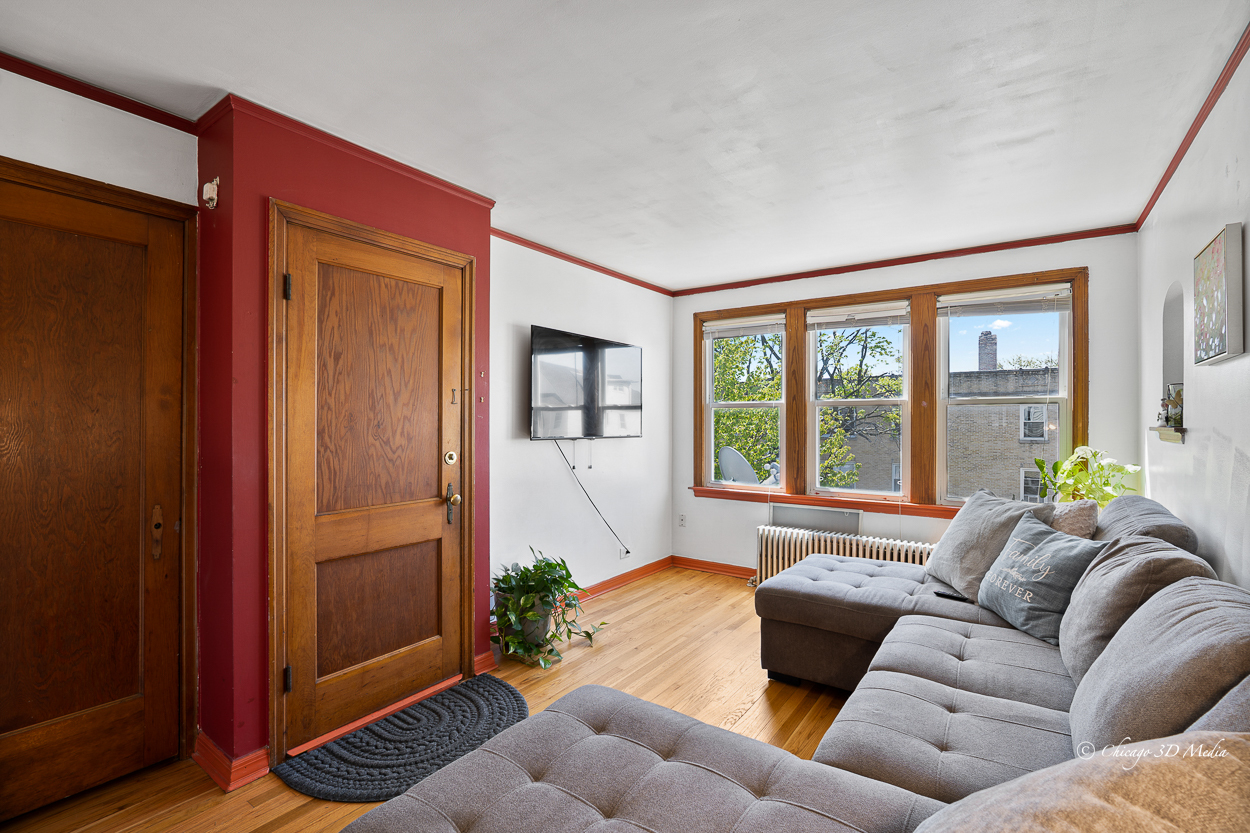 4954 West Byron Street Chicago, IL 60641 - Photo 17 of 42 a living room with furniture and a window