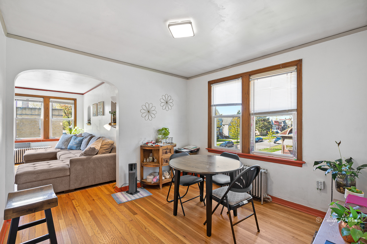 4954 West Byron Street Chicago, IL 60641 - Photo 18 of 42 a living room with furniture and a large window
