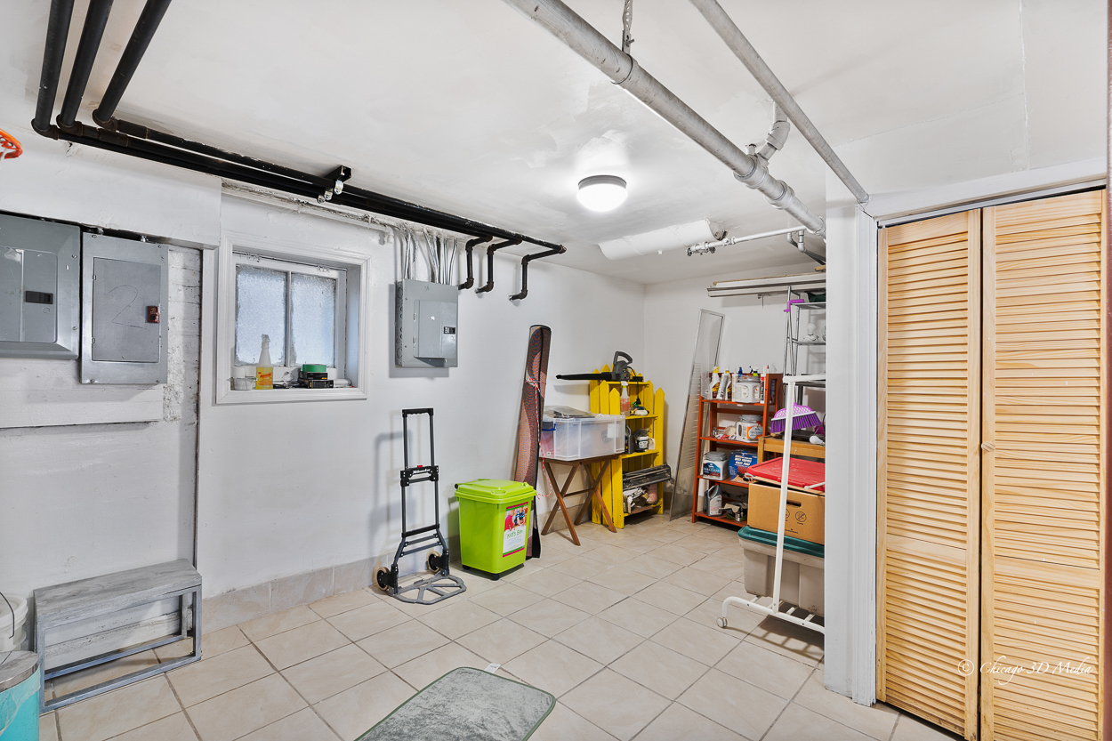 4954 West Byron Street Chicago, IL 60641 - Photo 24 of 42 a view of a storage & utility room with fridge and toys